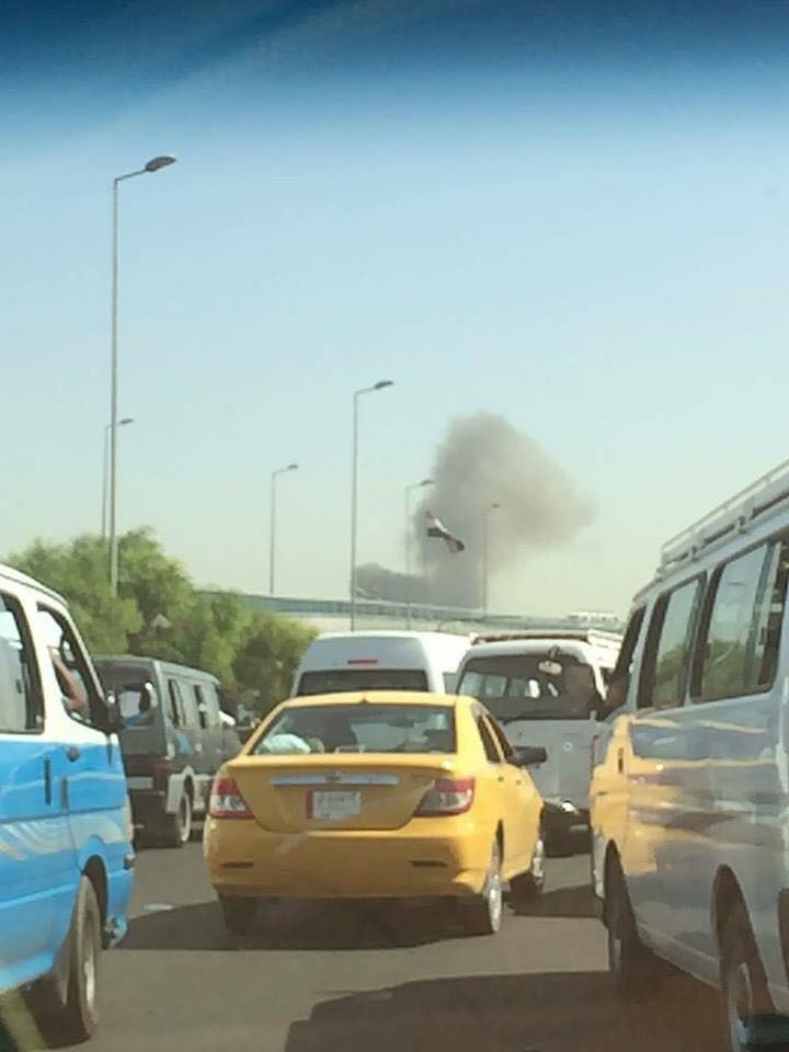 Photo posted on social media showing a black smoke rising from the site of the explosion in Baghdad, Iraq, May 30, 2017.